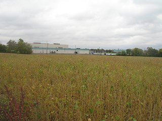 28.46 acres with 23.44 acres tillable with the balance in woods, ditch and road frontage on E. 32nd Street.  The property is located behind Lowe's on E. 32nd Street and has both city sewer and water, as well as 3 Phase Power.  The property is accessible from E. 34th Street.  - 28.46 Acres with 23.44 Acres Tillable with the Balance in Woods, Ditch & Road Frontage